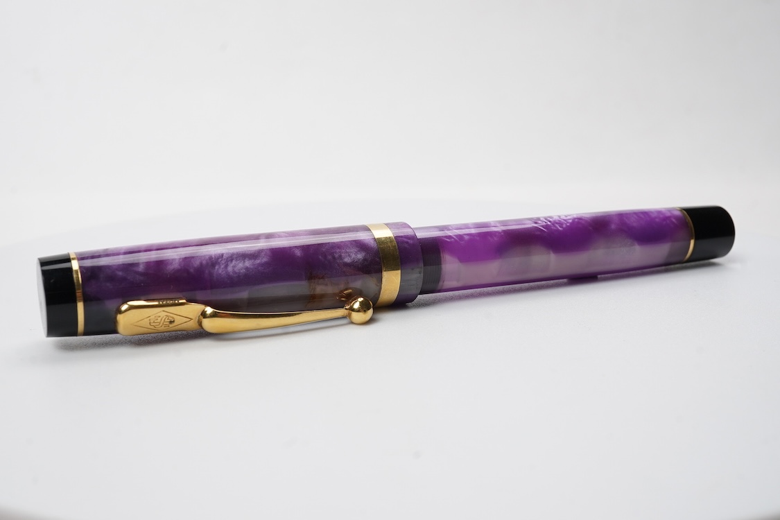 A modern Conway Stewart 'Duro' in stunning purple fitted with 18ct. gold medium nib